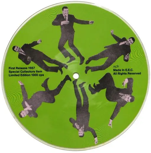 A green disc with a picture of people in suits