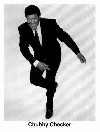 A man in suit and tie is jumping